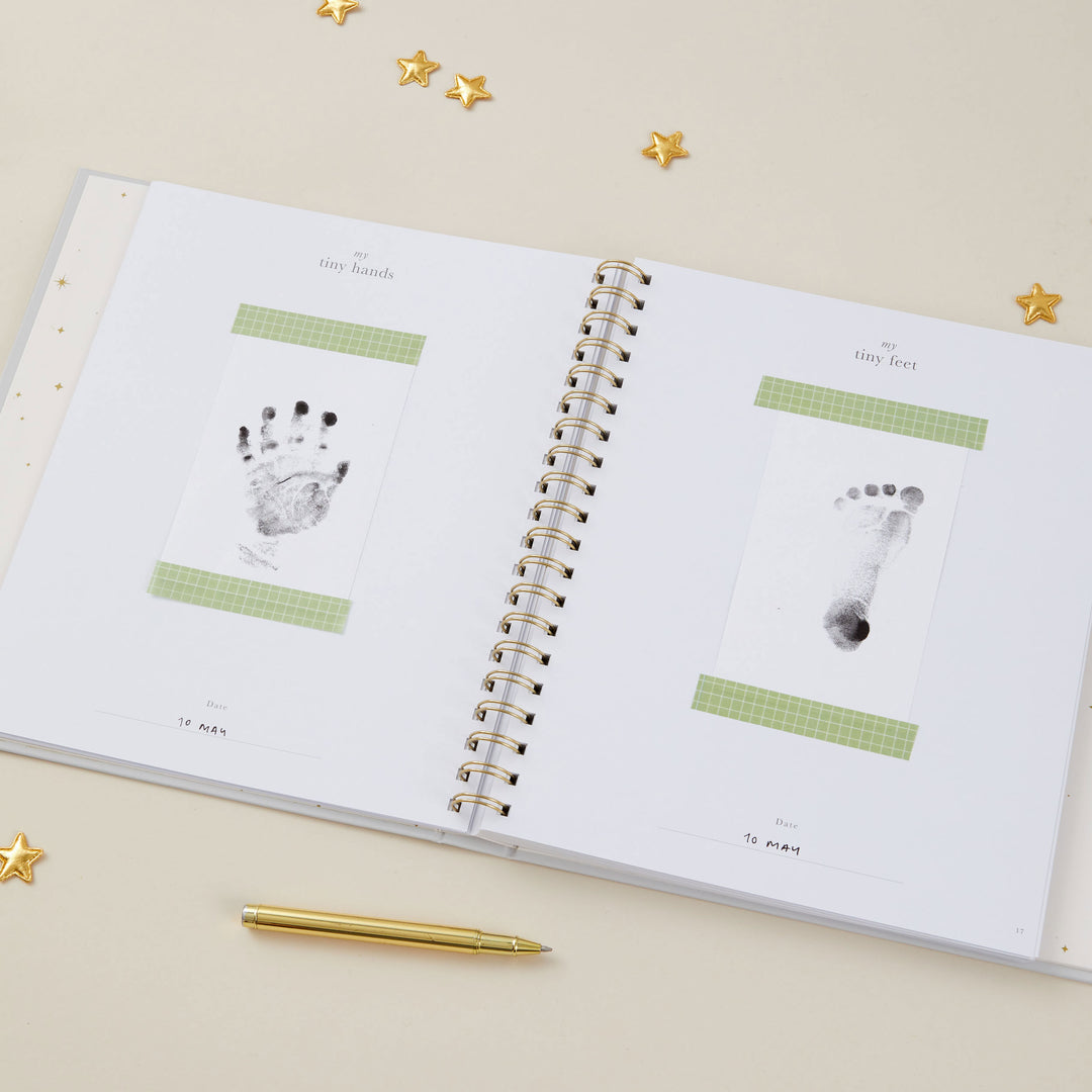 Baby record book 5 years showing handprint and footprint pages