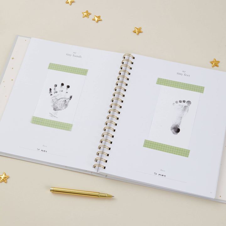 Baby record book 5 years showing handprint and footprint pages