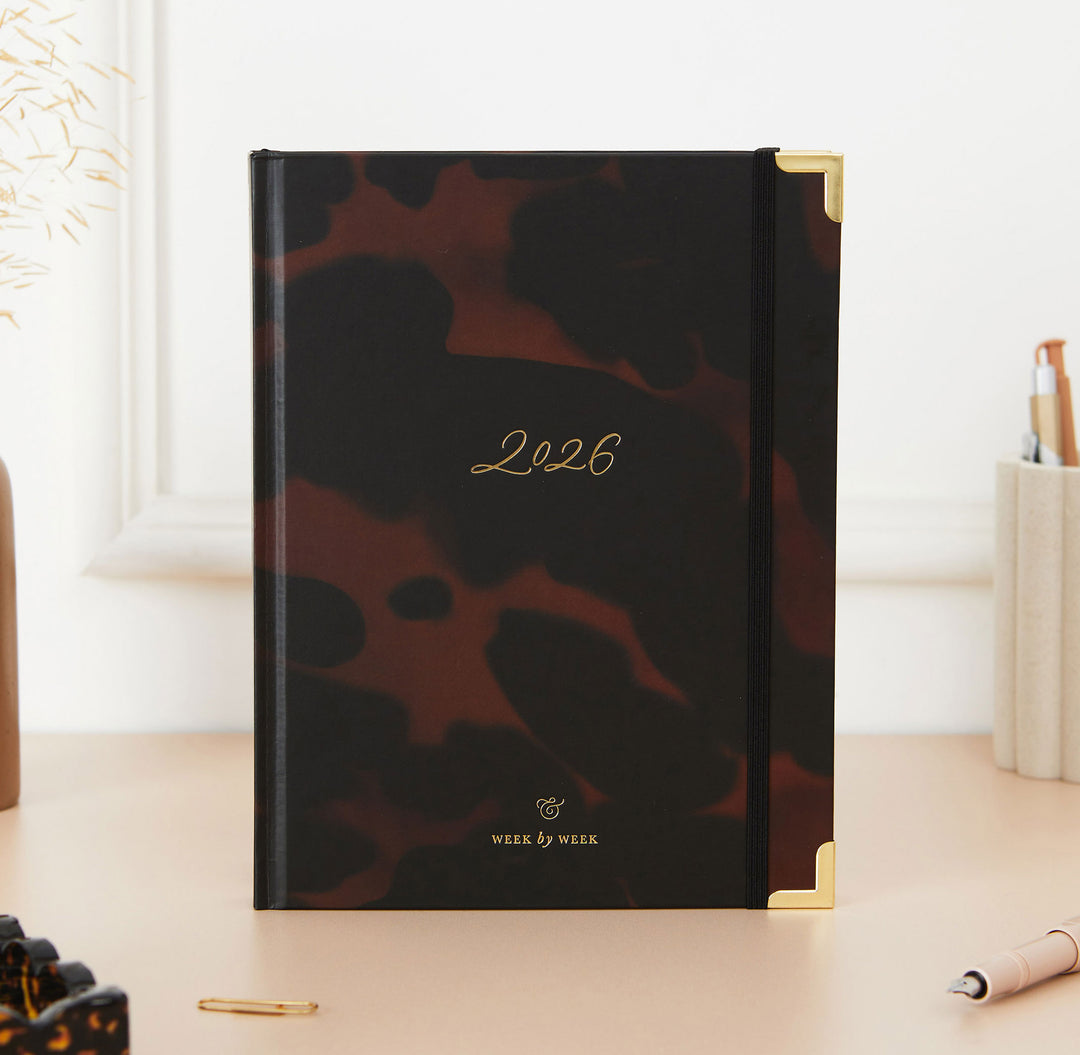 Leopard print planner with '2026' on a desk