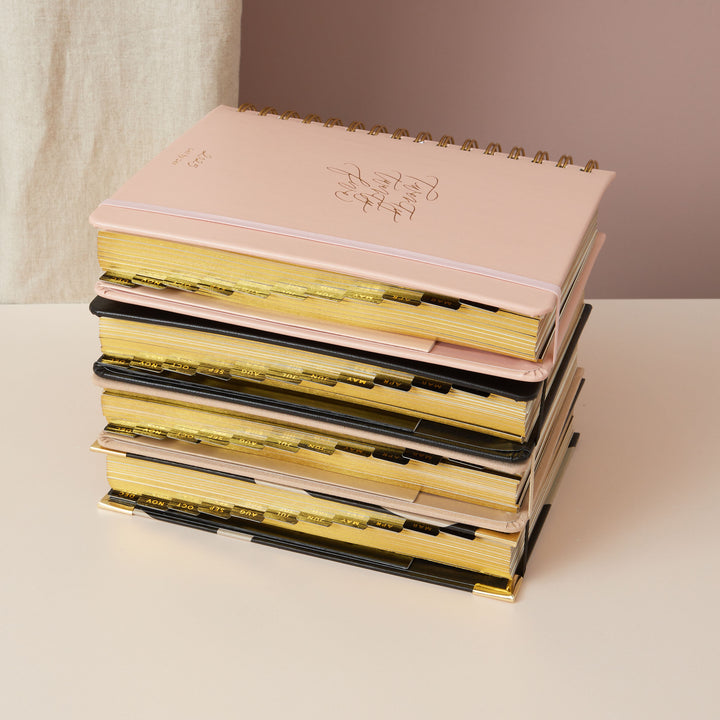 Pink day-to-page 2025 ring-bound planner with luxurious gold foiled edges for an elegant and stylish finish.