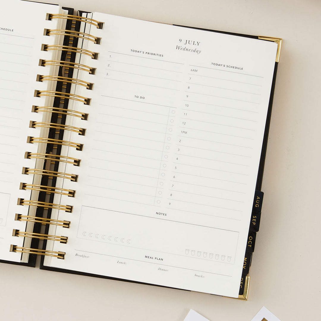 2025 daily planner with a time-blocking layout, including dedicated sections for to-do lists and meal plans, designed for comprehensive daily organisation and productivity.