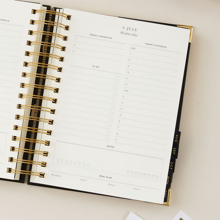 2025 daily planner with a time-blocking layout, including dedicated sections for to-do lists and meal plans, designed for comprehensive daily organisation and productivity.