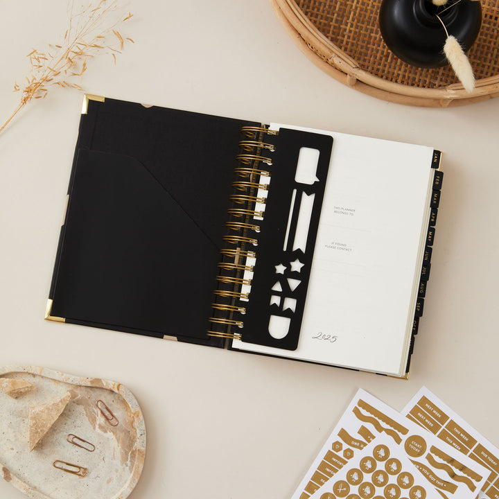 2025 daily planner featuring a built-in bookmark, offering a practical and convenient way to keep track of important pages, with a clean and organised layout.