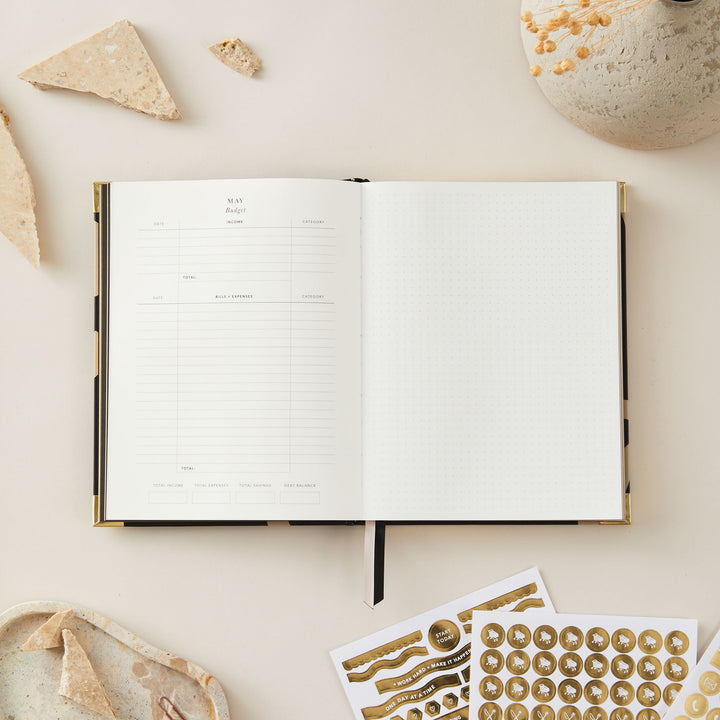 2025 planner with minimalist floral design, gold foil details, and gold edging, featuring week-to-view pages with time-blocking, to-do lists, and space for notes.