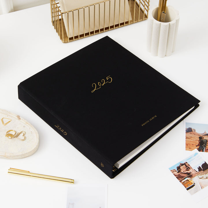 Sophisticated 2025 photo album with blank pages and golden accents, perfect for preserving and gifting.