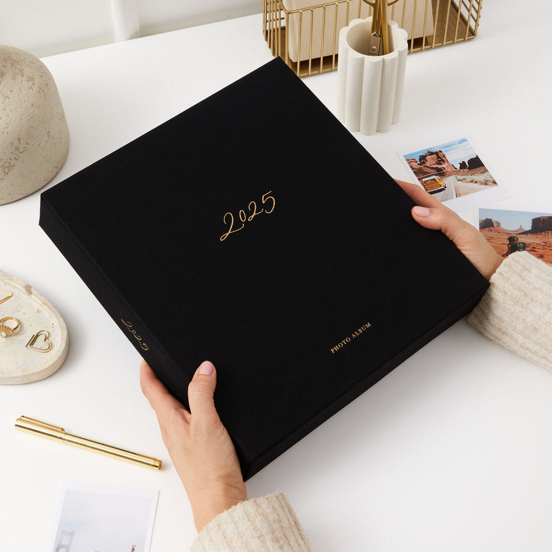 Timeless 2025 photo album with blank pages and sophisticated gold embellishments, a thoughtful Christmas present.