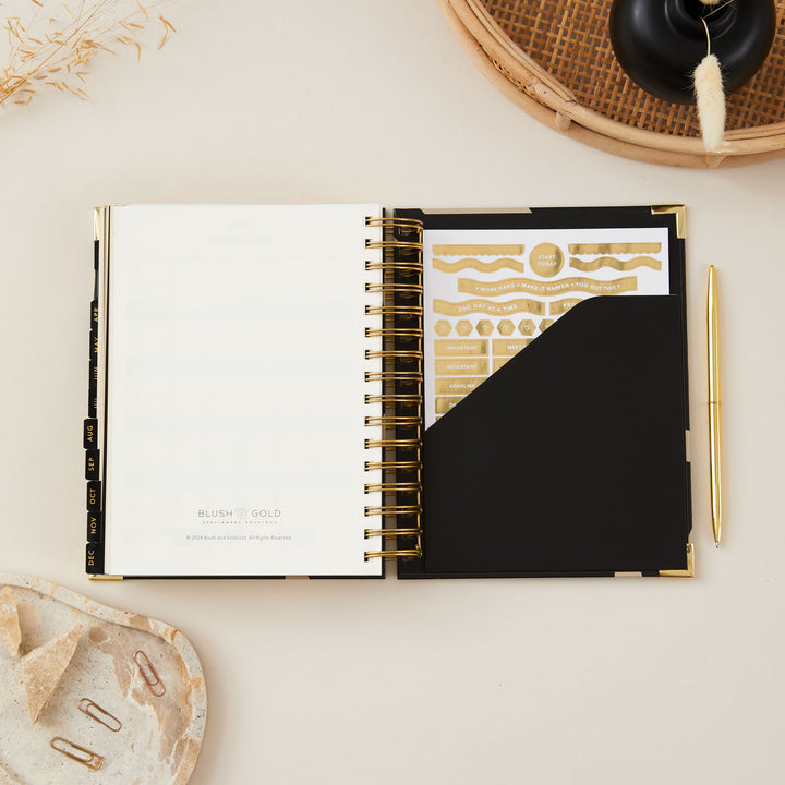 2025 daily diary featuring a convenient back pocket for storing notes and papers, along with gold stickers for personalisation and added style.