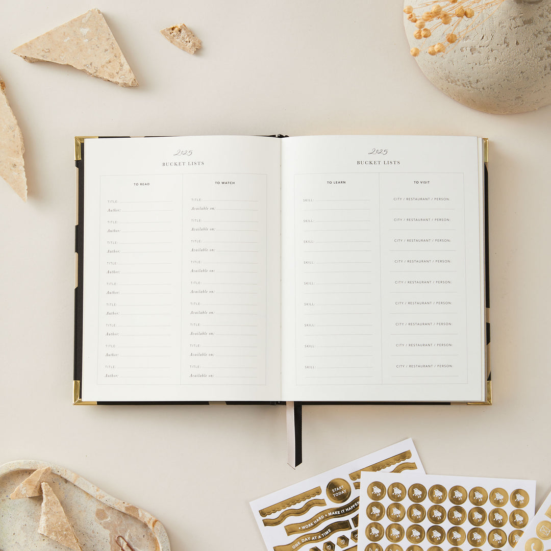 2025 weekly planner featuring a minimalist floral design, gold foil cover, and gold edging, complete with time-blocking, to-do lists, notes, and budget pages.