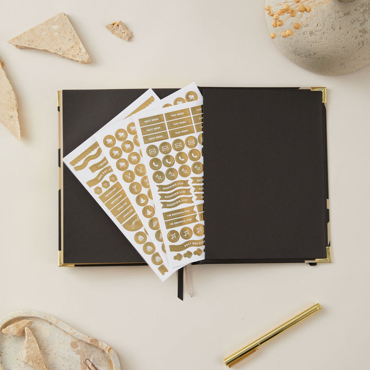 2025 planner with a minimalist floral design and gold foil cover, featuring week-to-view layouts with time blocking, to-do lists, note space, and monthly goals and budget pages.