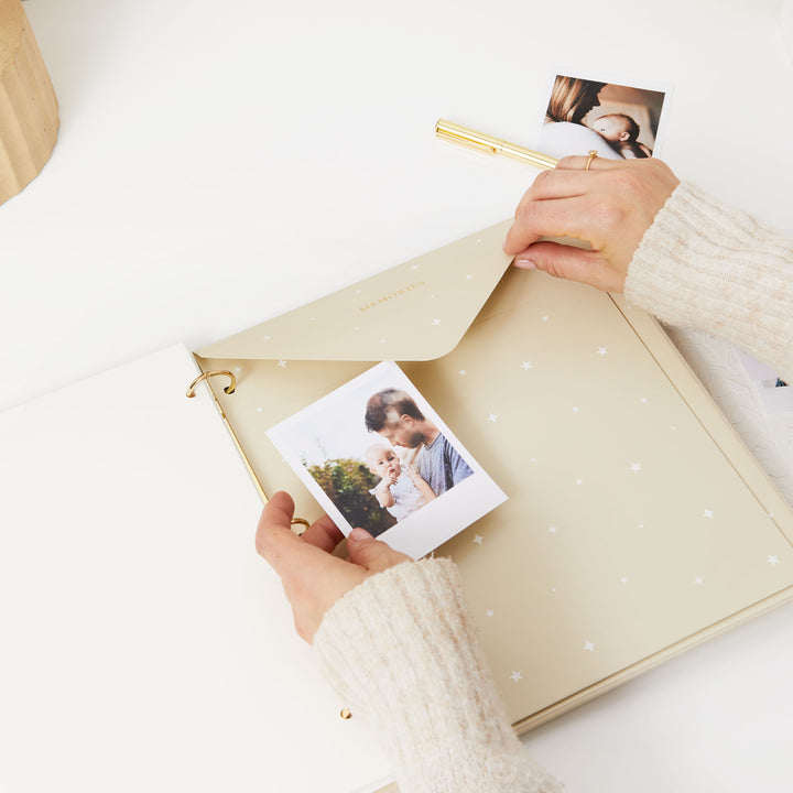 Baby memory book with a foiled envelope, perfect for storing cherished memories and photos of your little one's milestones.