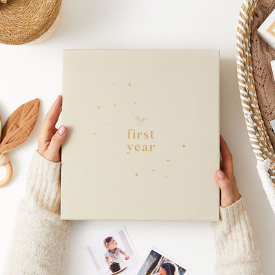 Baby photo album with a timeless design, an ideal gift for new parents to treasure and organise their baby's precious memories.