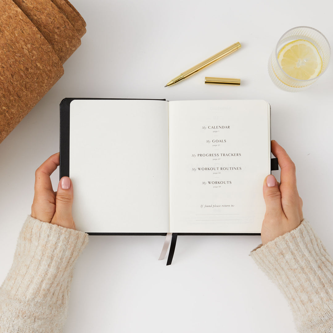 Black fitness journal for setting and tracking fitness goals