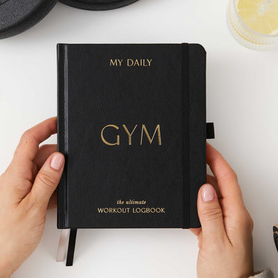 Black gym planner for tracking fitness and weight loss goals