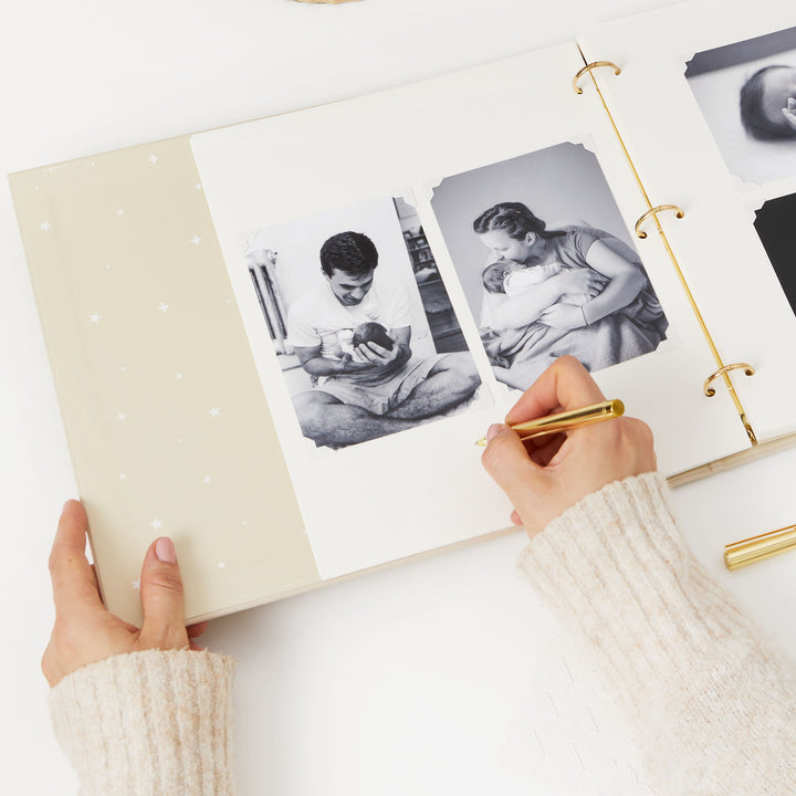 Blank baby photo album with a safari theme, featuring gold foiled details and whimsical animal illustrations – perfect for preserving cherished baby memories.
