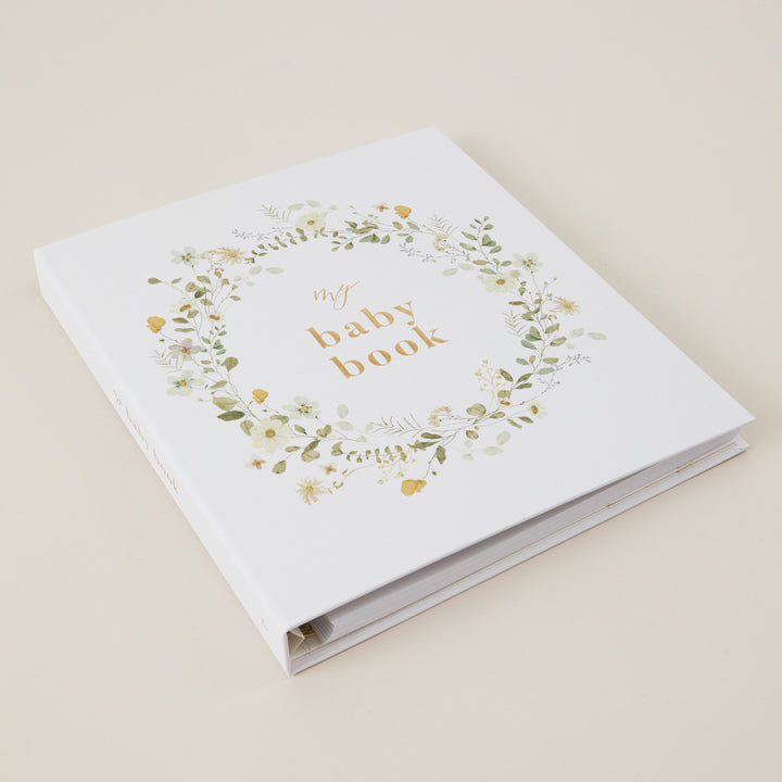 Beautiful floral baby record book with gold foiled details, cloth cover design, and gender-neutral pages for newborn memories.