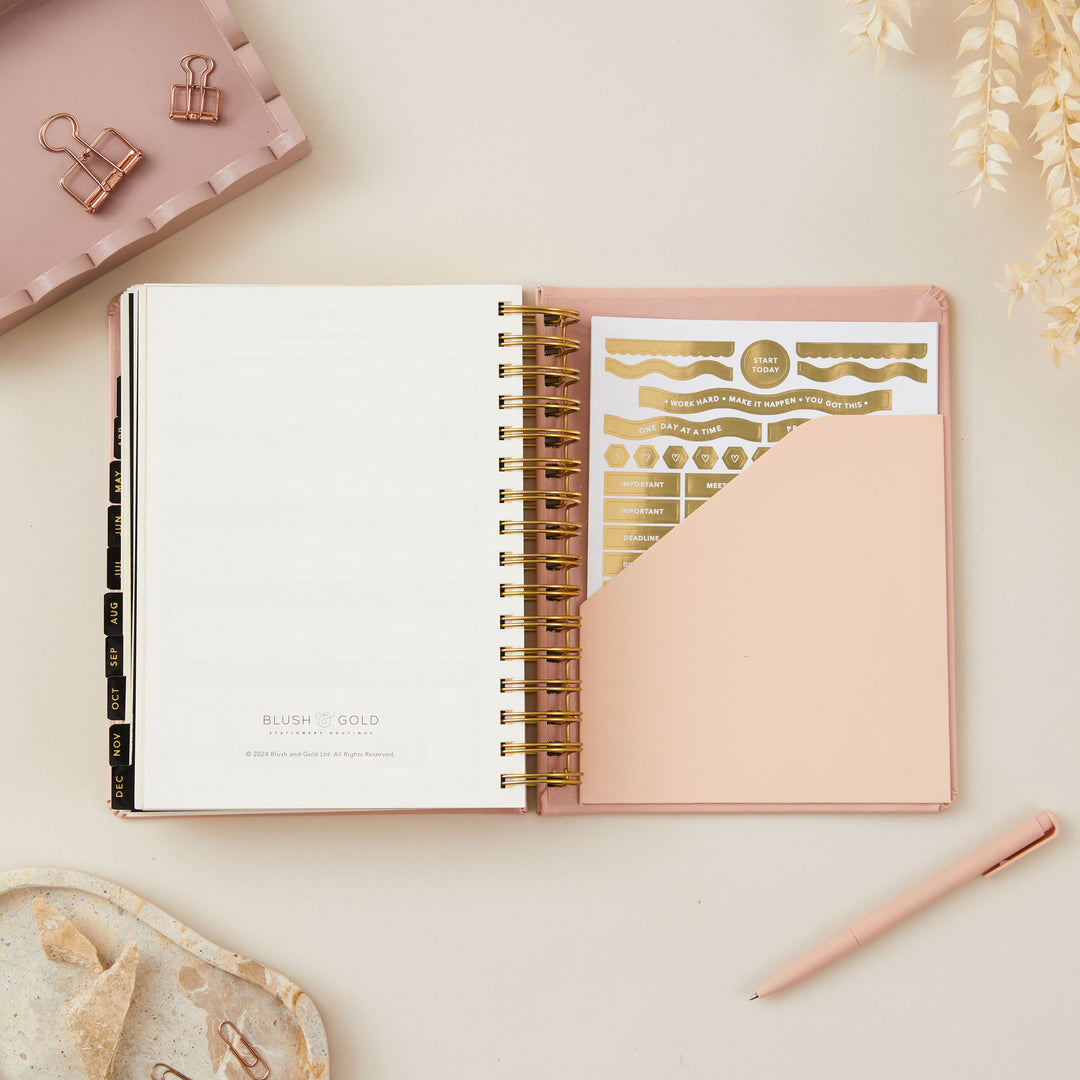 2025 daily planner accompanied by gold stickers, adding a touch of personalisation and elegance to your planning.