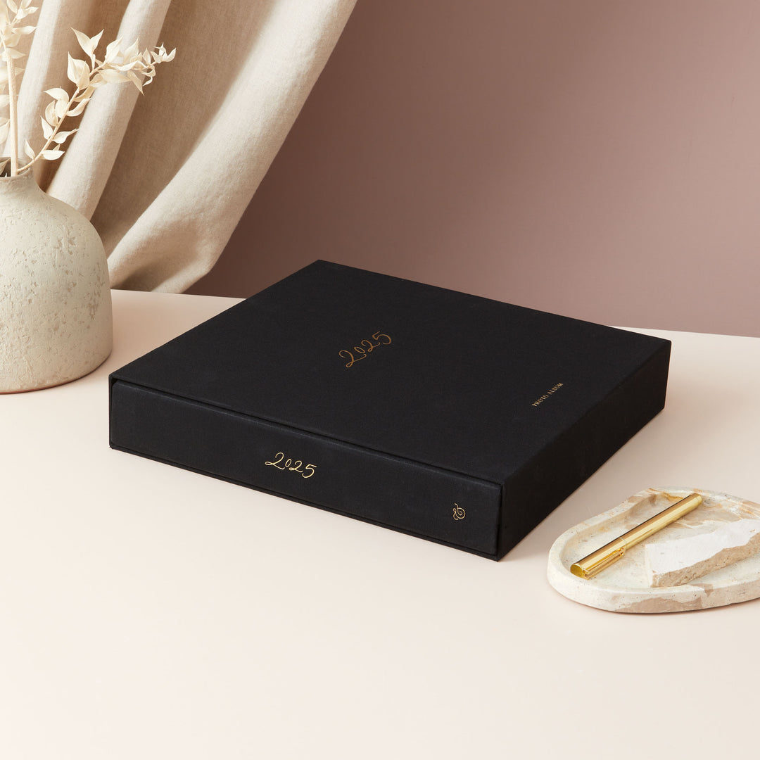 Elegant 2025 photo album featuring blank pages and gold accents, an ideal Christmas gift for loved ones.