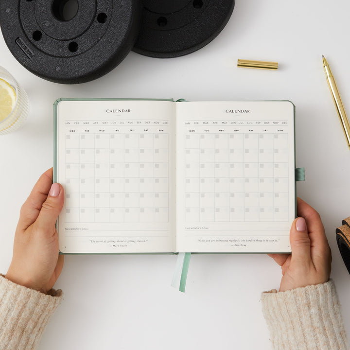 Elegant light green gym planner for daily fitness tracking