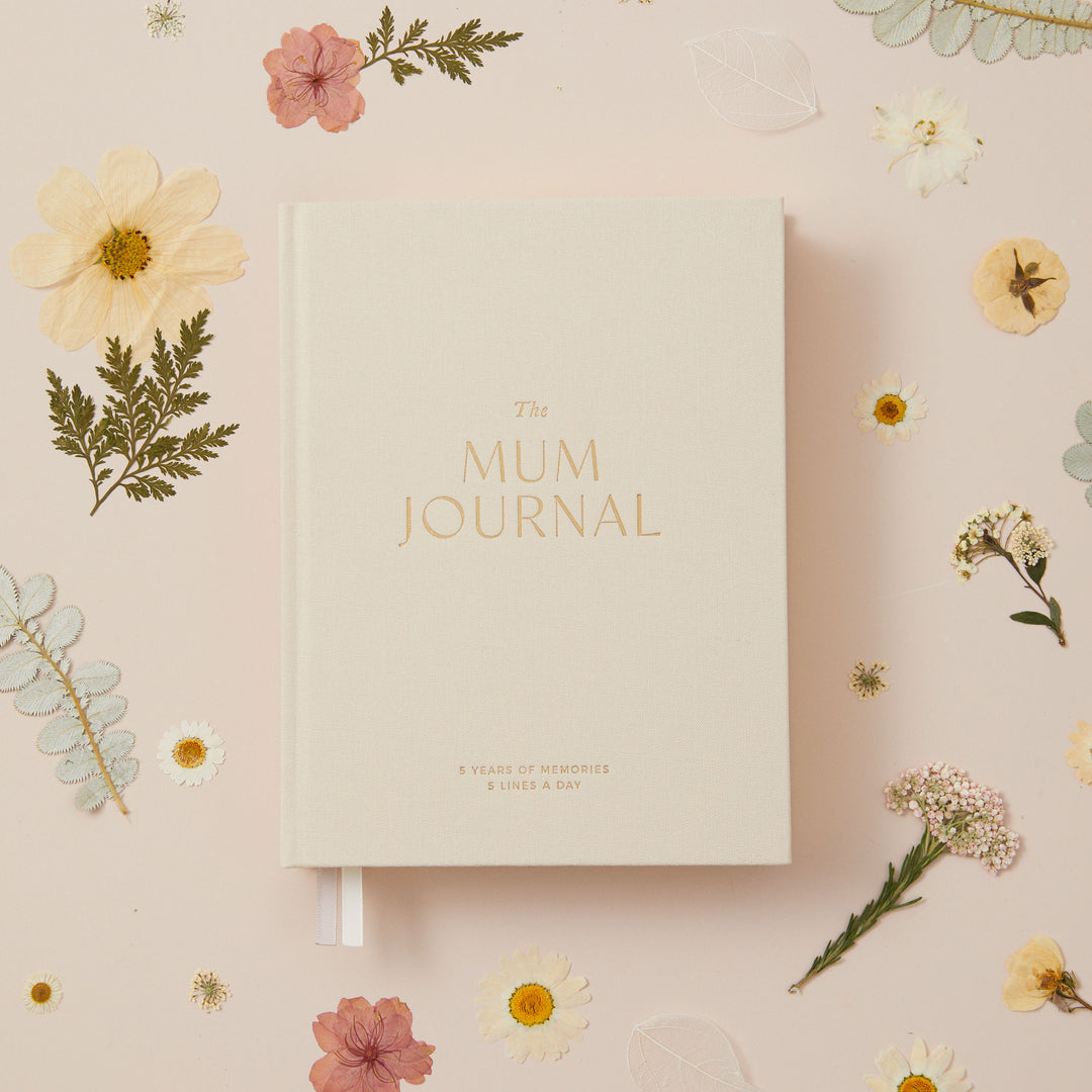 Five year mum journal with ivory cloth cover designed to capture the same day across five years