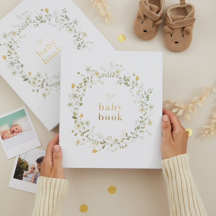 Floral baby memory book with cloth cover, delicate floral illustrations, and gold foil details – gender-neutral keepsake journal from birth to 5 years.