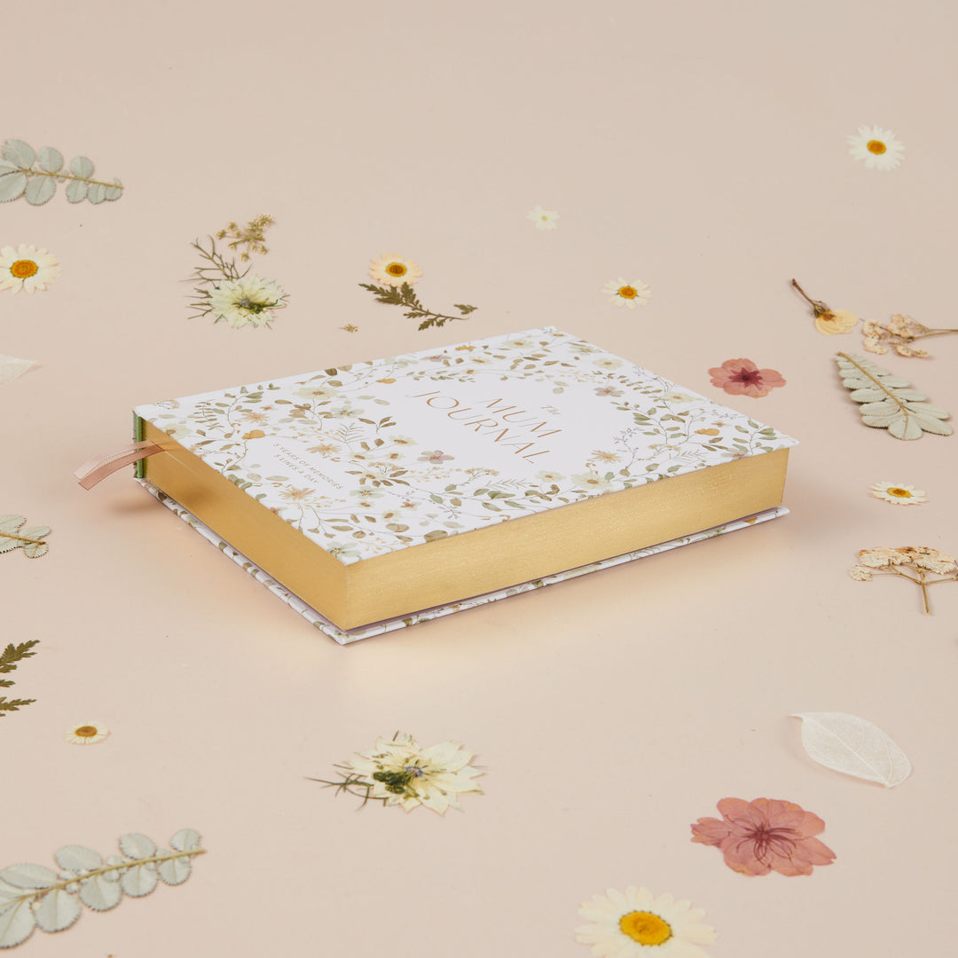 Floral mum journal featuring dainty wildflower illustrations and space to record memories over five years