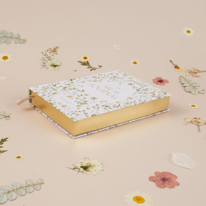 Floral mum journal featuring dainty wildflower illustrations and space to record memories over five years
