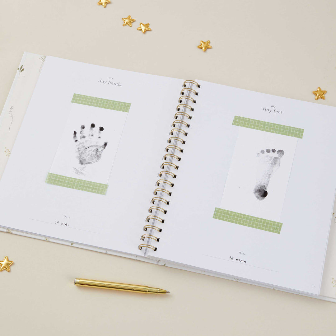 Delicate floral baby keepsake book with foiled details, gender-neutral design for new parents.