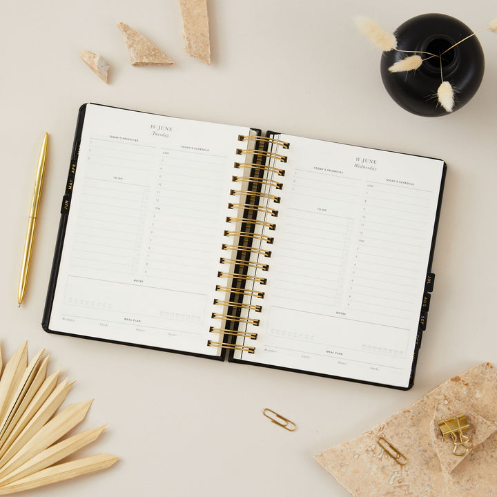 2025 daily diary with time-blocking sections, to-do lists, priorities, and meal planning, designed for efficient and organized daily scheduling.