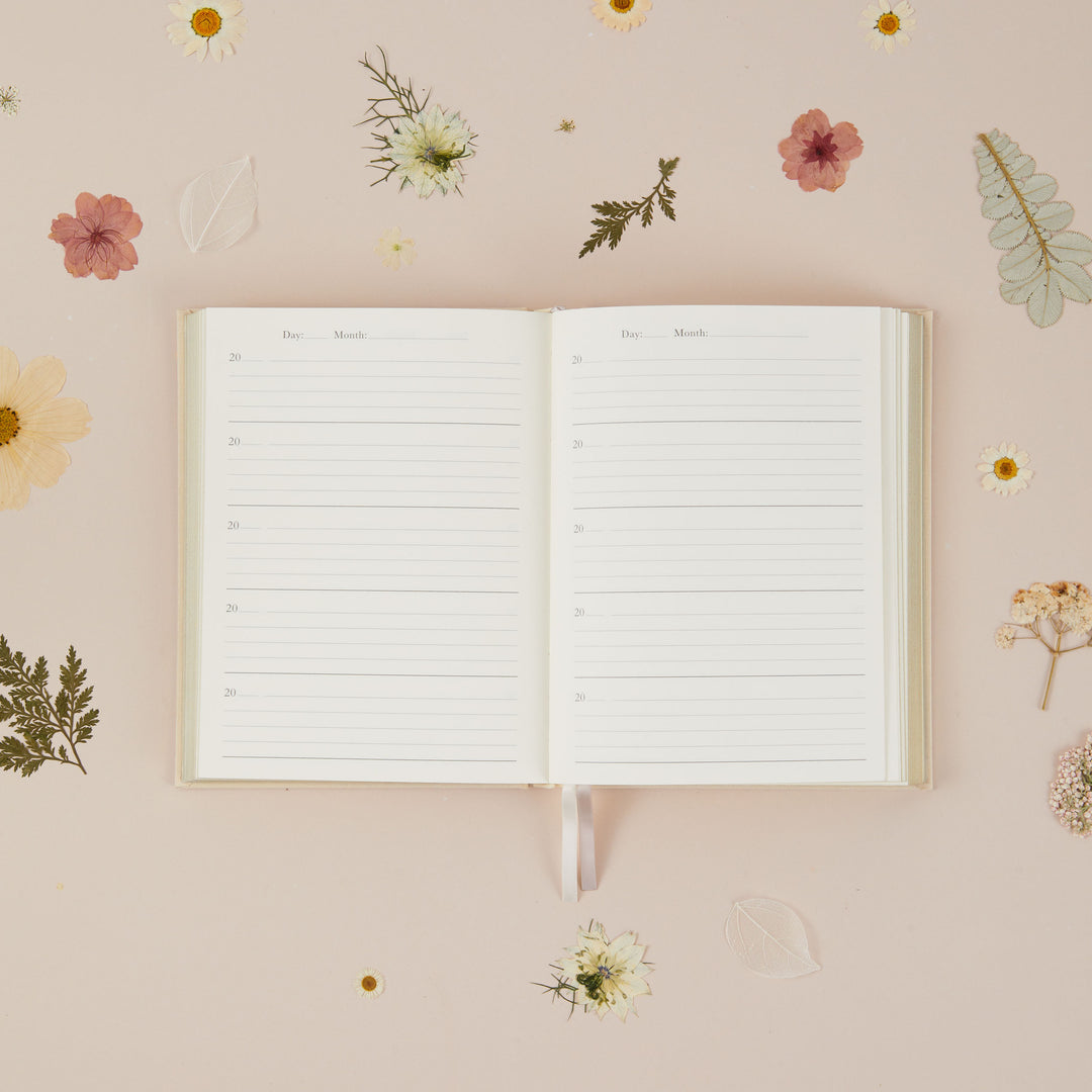 Motherhood memory journal with ivory cloth cover, minimalist design and timeless keepsake style