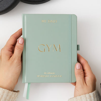 Light green gym planner for tracking fitness and weight loss goals