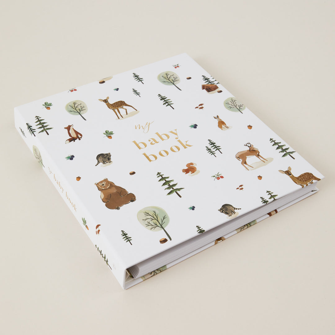 Gender-neutral woodland baby record book from birth to 5 years.