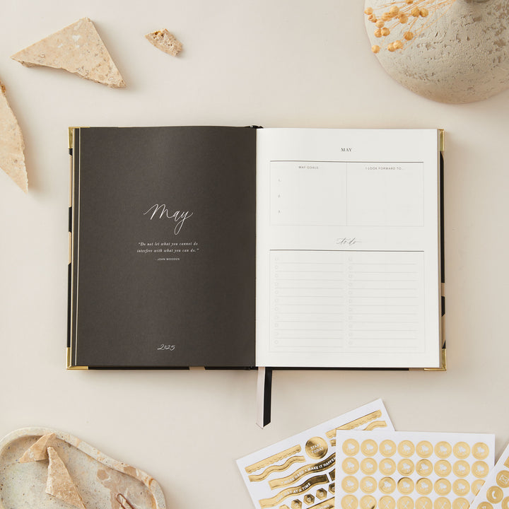 Floral-themed 2025 weekly planner with a minimalist design, gold foil cover, and gold edging, including weekly time-blocking, to-do lists, and monthly goal pages.