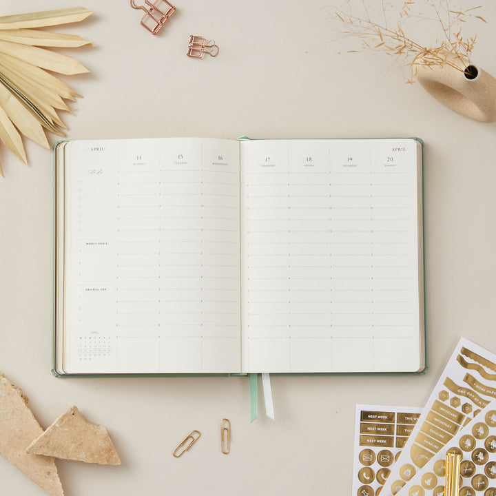 Sage green vegan leather 2025 weekly planner with gold details, offering weekly time-blocking, equal space for each day, to-do lists, and sections for notes and monthly goals.