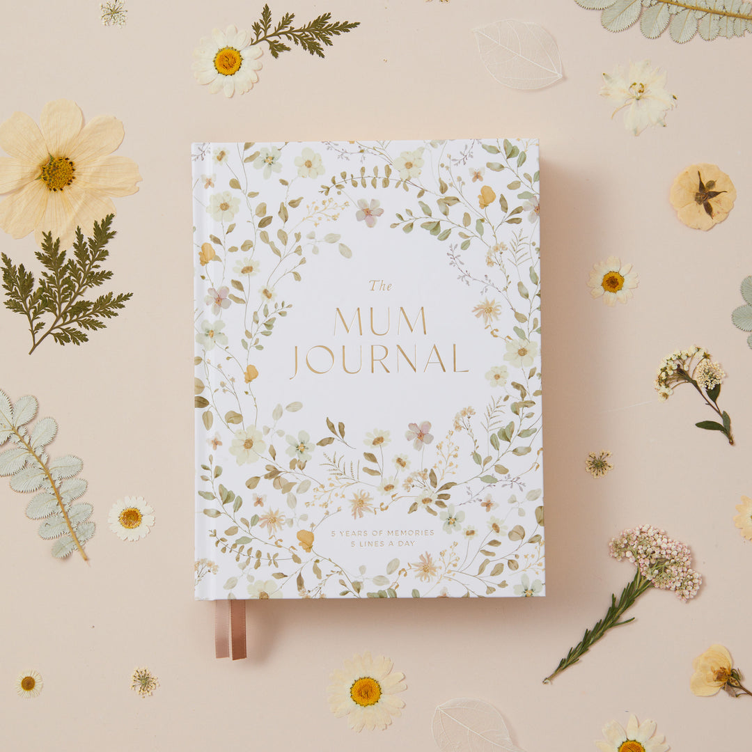 Mum journal with soft watercolour wildflower artwork on the cover, a five year motherhood keepsake