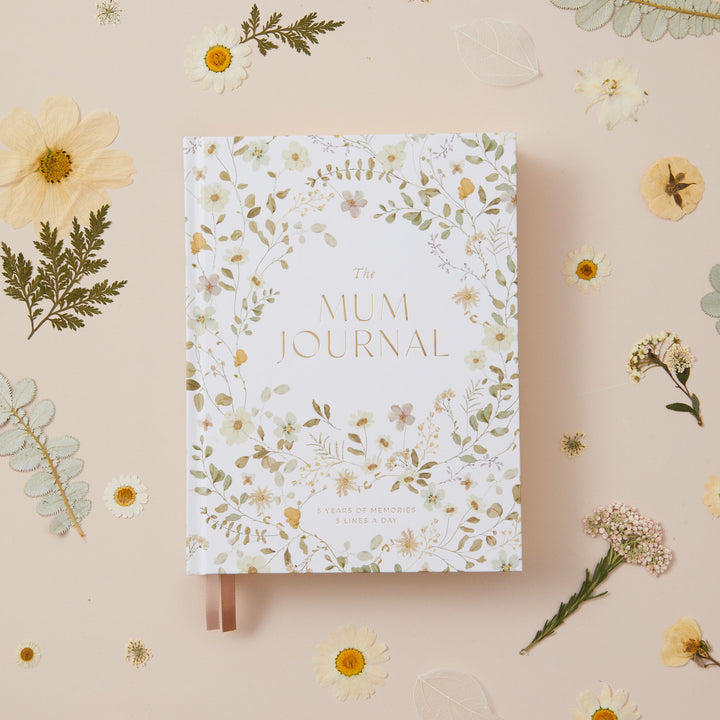 Mum journal with soft watercolour wildflower artwork on the cover, a five year motherhood keepsake