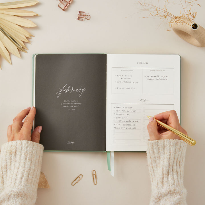 2025 planner in sage green vegan leather with gold details, offering equal space for daily time-blocking, to-do lists, and monthly goals and budget tracking.