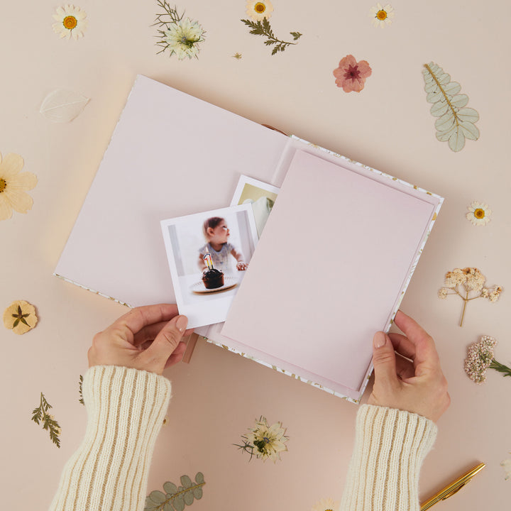 Flat lay of a wildflower mum journal highlighting delicate floral illustrations and premium design