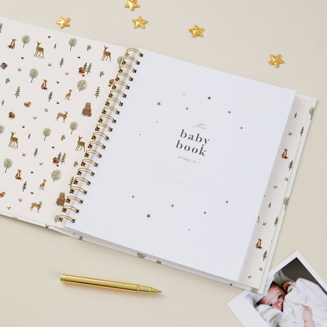 Woodland baby milestone journal with bears, squirrels and reindeers.