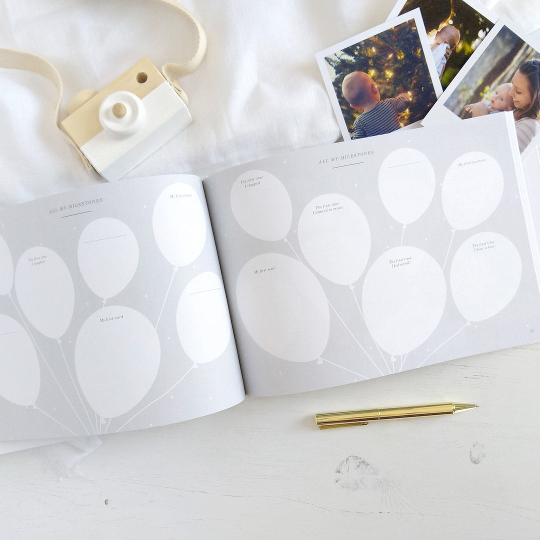 Page for milestones and observations during baby's first year, featuring sections for developmental notes and cute illustrations of stars..
