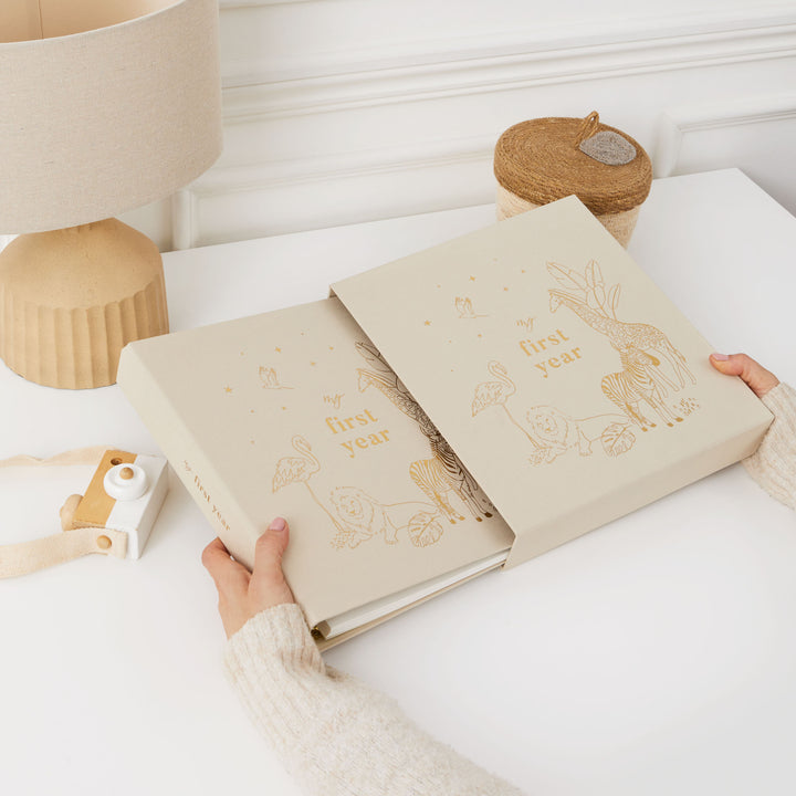 Blank baby photo album adorned with gold foiled details and charming animal illustrations – a beautiful keepsake for preserving precious baby memories.