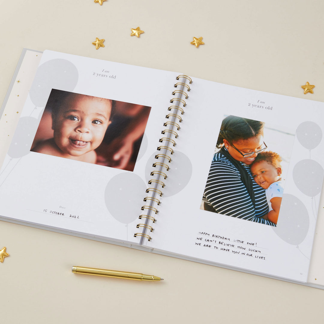 Beautifully illustrated baby record book pages