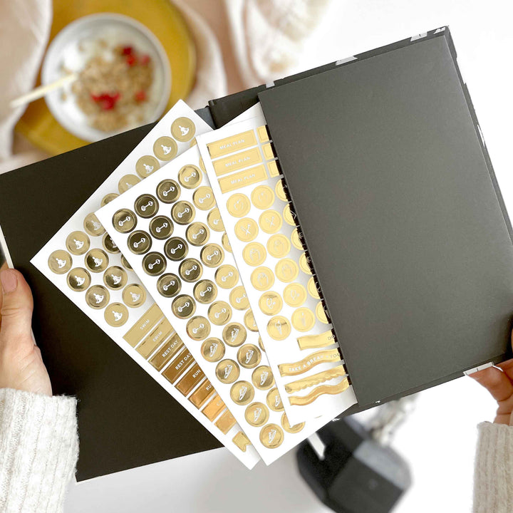 Flat lay of daily workout planner with gym gear and headphones