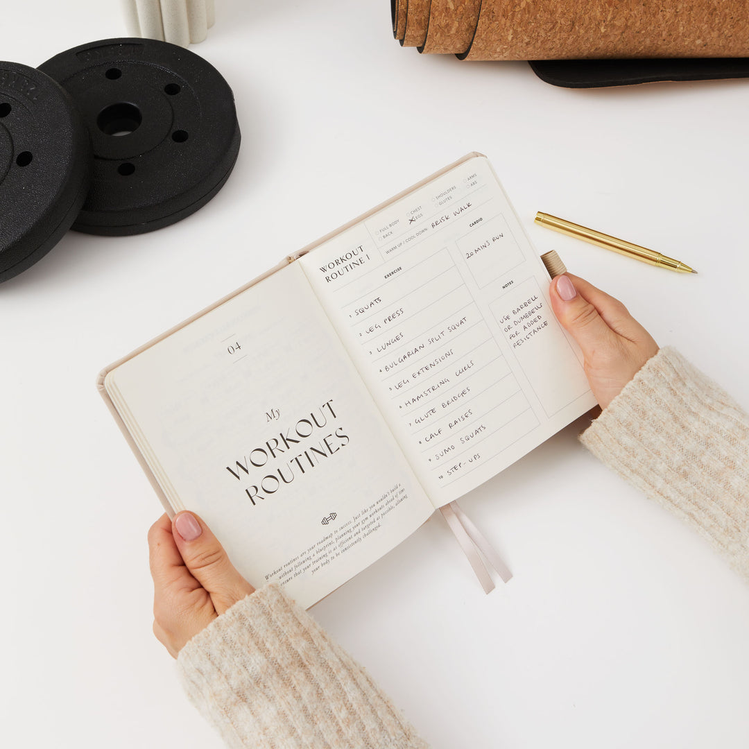Beige fitness tracker and progress journal for weight loss