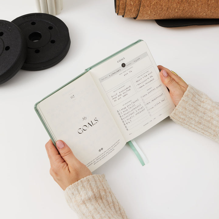 Light green gym planner for daily workout and weight loss logs