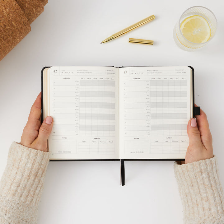 Elegant black gym planner for fitness and weight management