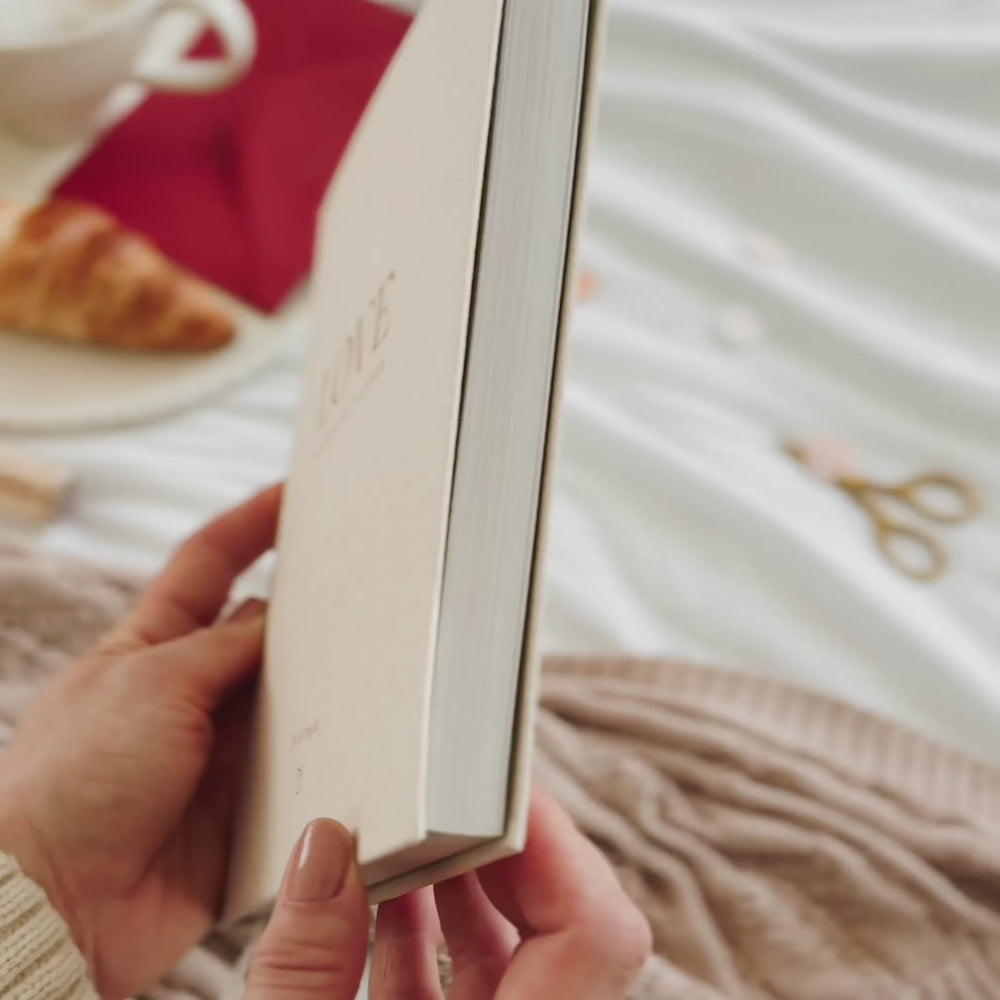 Inclusive wedding planner with ivory cover and gender-neutral language