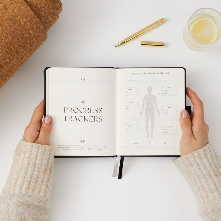 Neutral black workout journal for detailed fitness tracking