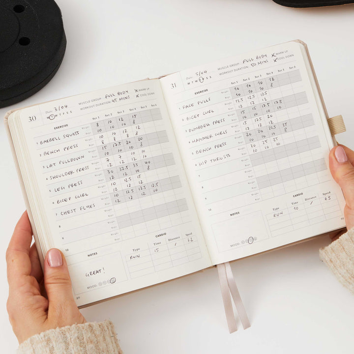 Blush pink planner for workout routines and measurements