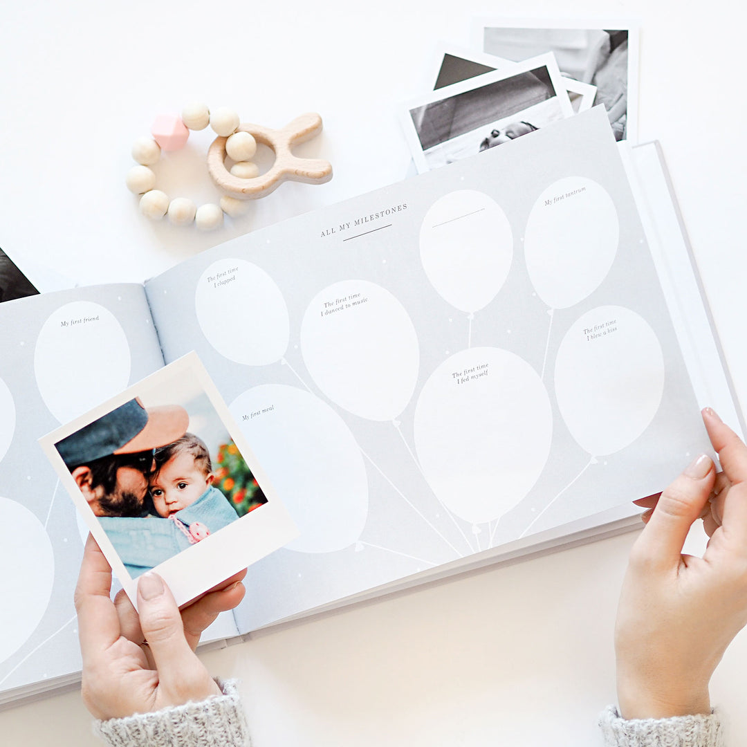 Milestone page for baby's first smile, with space for a photo and notes